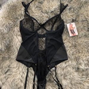 Black lingerie one piece w/ garter included.